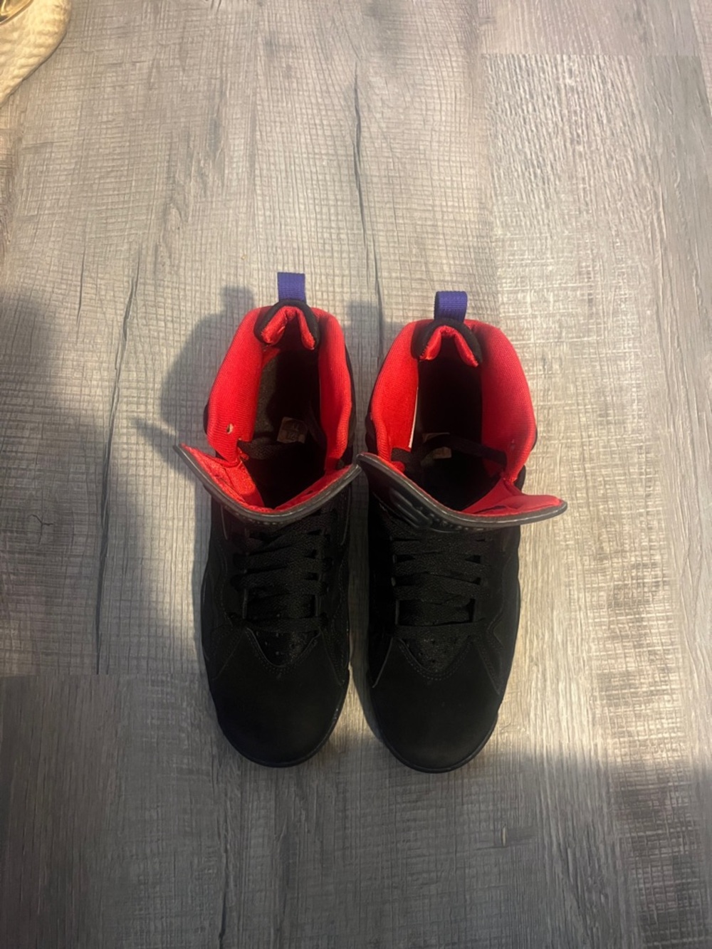 Nike Air Black High-Top Sneakers with Red Lining and Purple Pull Tab